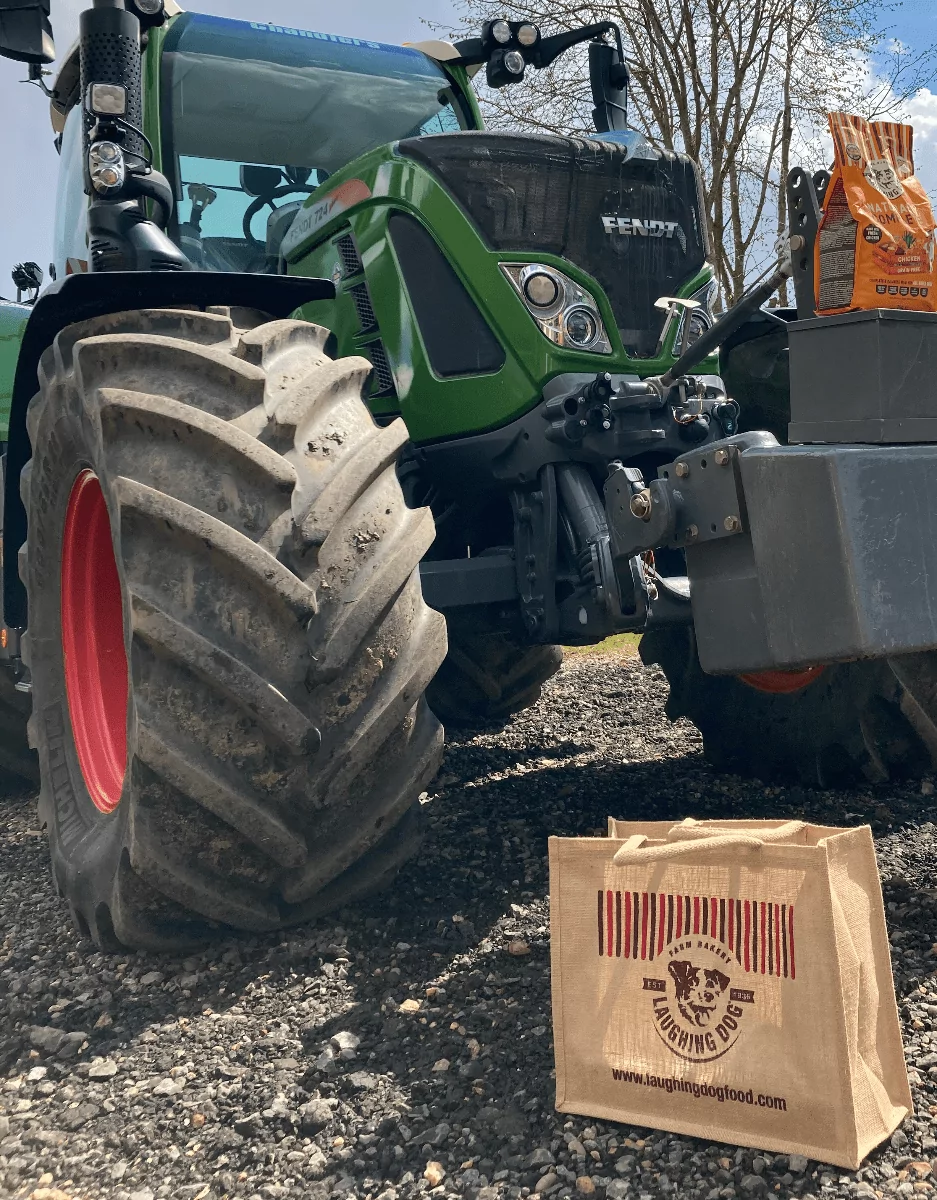 Jute bag and tractor on farm | Laughing Dog Food